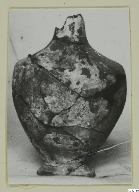 Reassembled jar from Amathus tombs 10–26, shown on a photo card