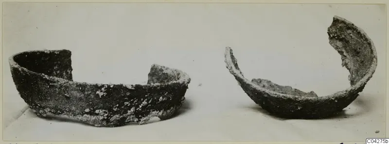Two fragmentary bowls, encrusted with pale deposits, photographed side by side; from Amathus