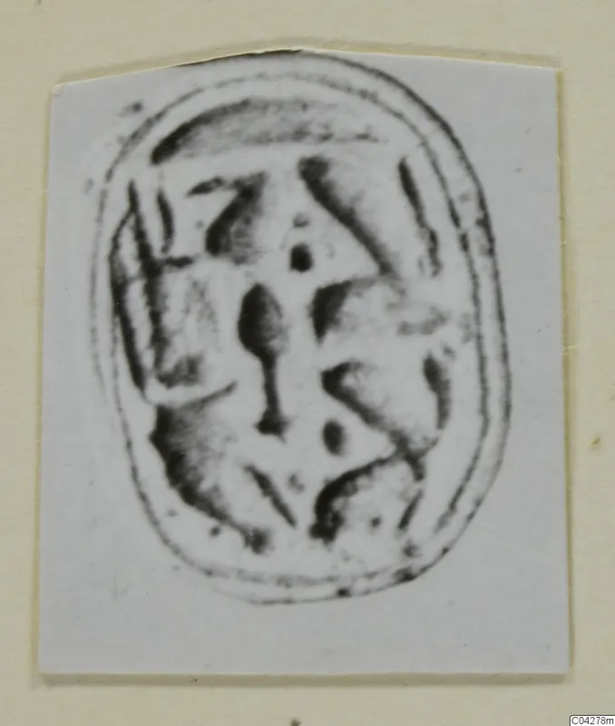Glyptic from Amathus: an oval seal or scarab with dark incised markings, shown as a print on a card mount