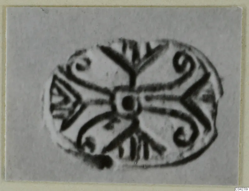 Engraved oval glyptic from Amathus, with a central dot, radiating lines, spirals and chevron-like strokes.