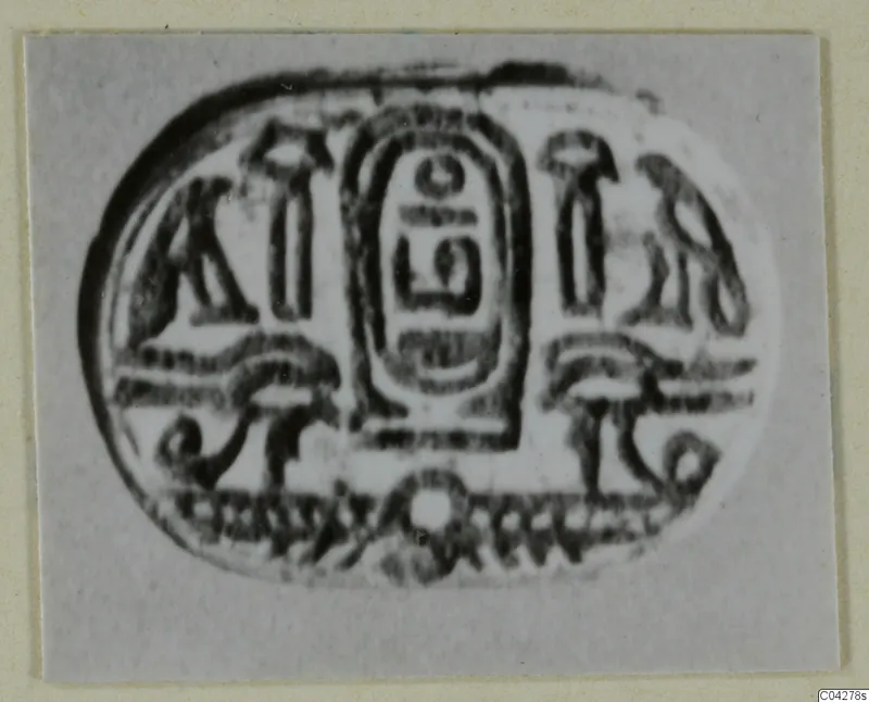 Oval engraved seal from Amathus with a central oval panel of signs flanked by smaller motifs