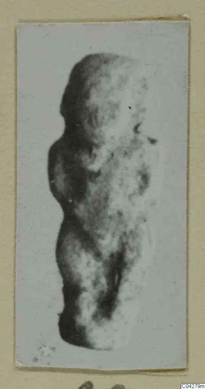 Blurred photograph of a small standing figure from Amathus, tombs 2–26
