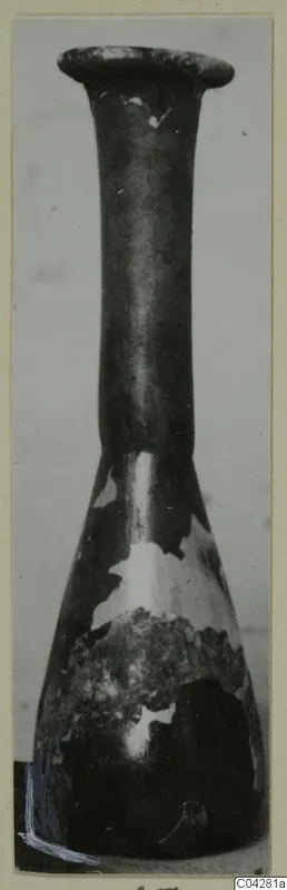 Dark narrow-necked vessel from Amathus with a flaring rim; surface flaking in places
