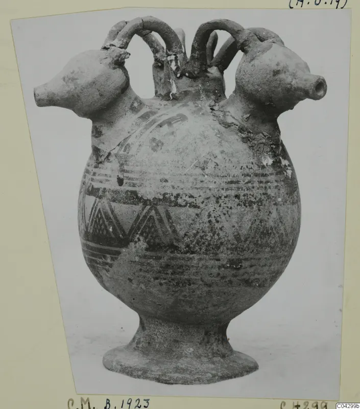 Pottery White Painted I jug with two spouts and arched handles, photographed on a mounted card