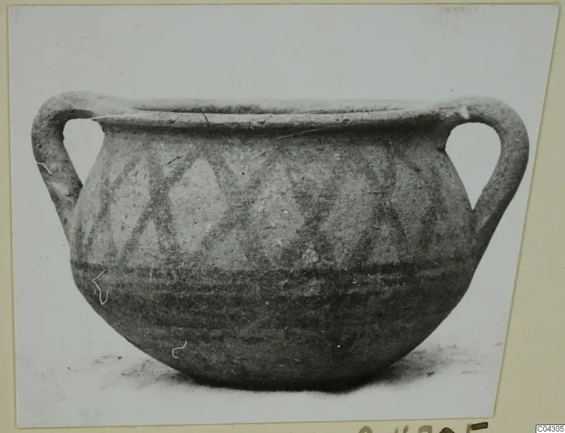 Two-handled painted pottery vessel from Idalion, with crossing diagonal bands on the upper body