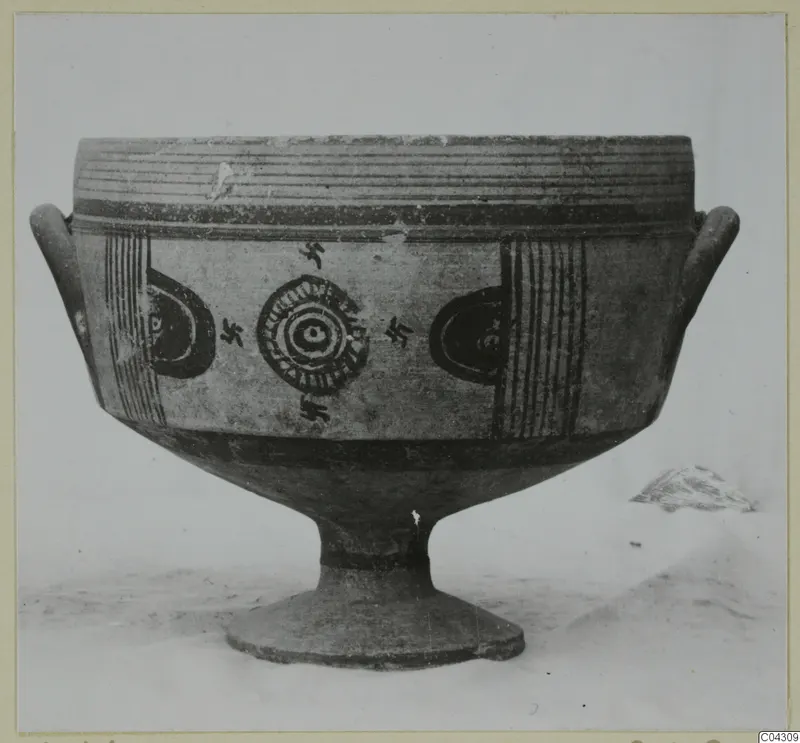 Bichrome IV footed bowl with two side handles, painted with concentric circles and small cross motifs