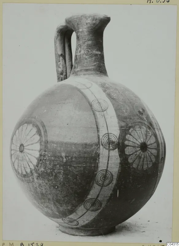 Round-bodied painted jug with a strap handle, a broad pale band and dark concentric circles and rosettes
