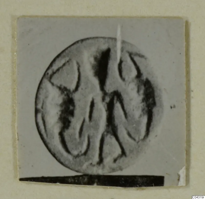 Engraved stone seal or gem from Amathus, photographed close up with raking light.