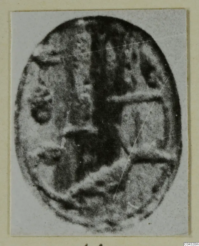 Oval object with a pattern of raised bands and a dark central stripe, from Amathus