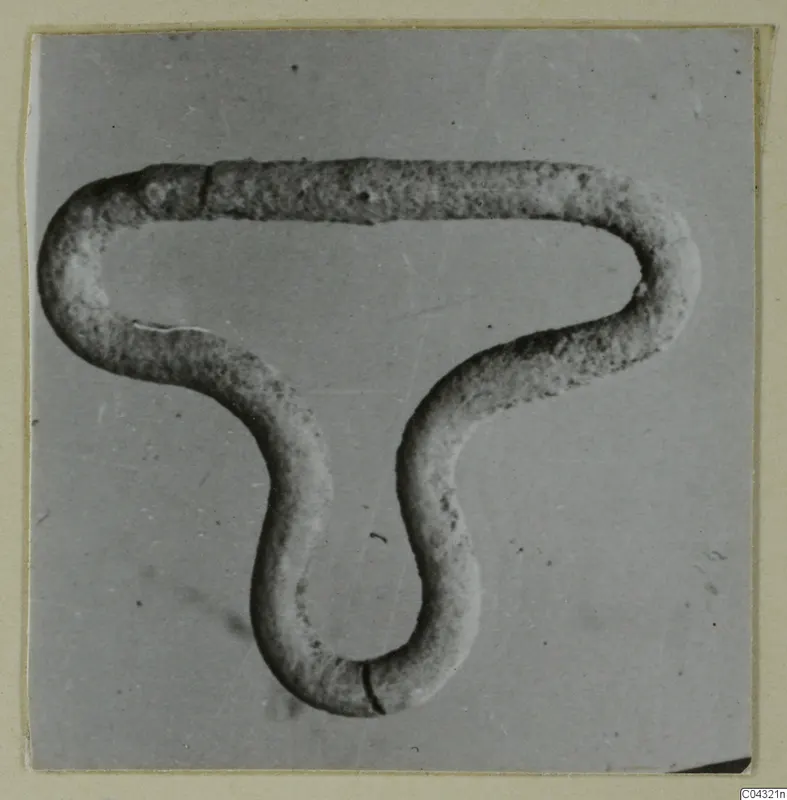 Bent rod-shaped object from Amathus, shaped into a looped, three-armed form