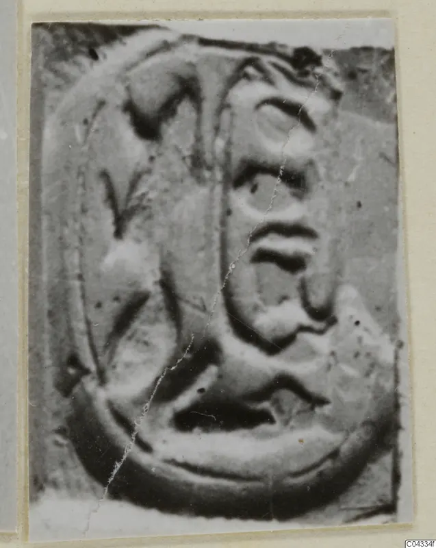 Close-up photograph of a carved seal face with a raised oval border and relief design