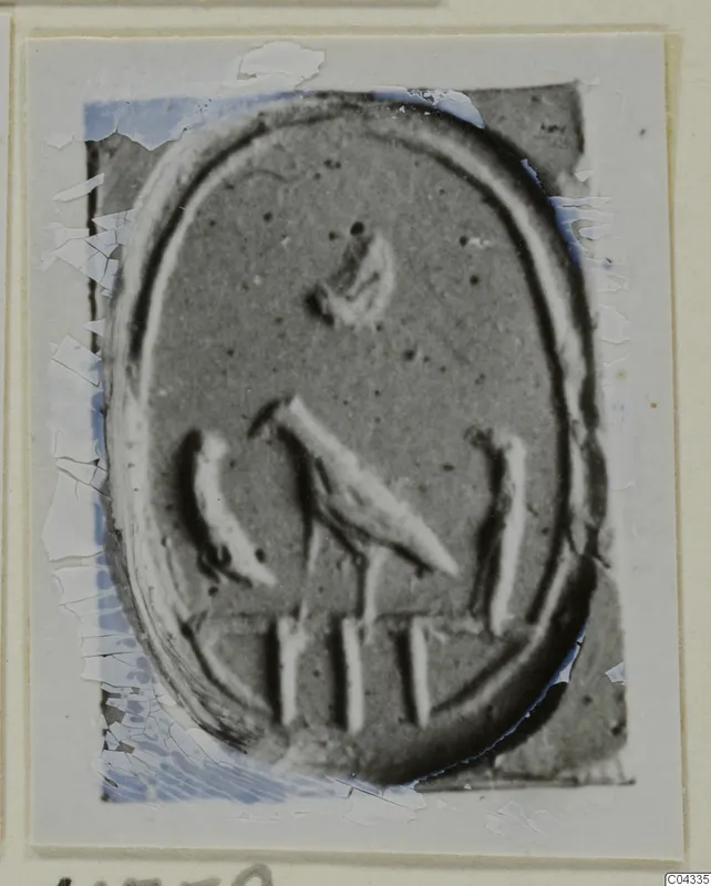 Enlarged photograph of an oval engraved seal or gem, mounted on a card