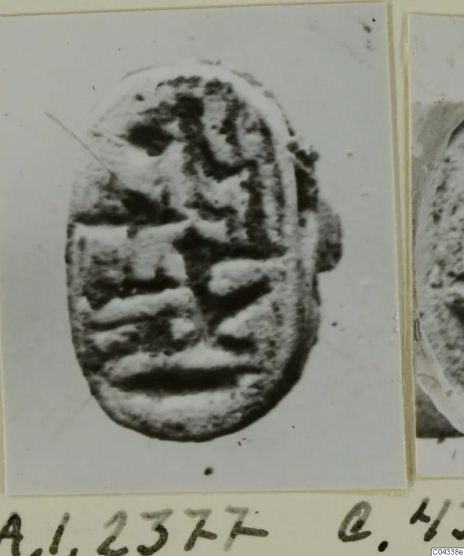 Glyptic object A.I.2377, an oval seal or gem with a raised design of curved and horizontal bands