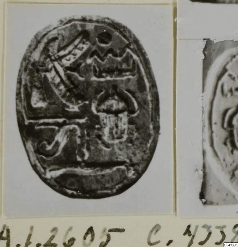 Oval stone seal with an engraved design, from Ayia Irini, shown on a pale mount.
