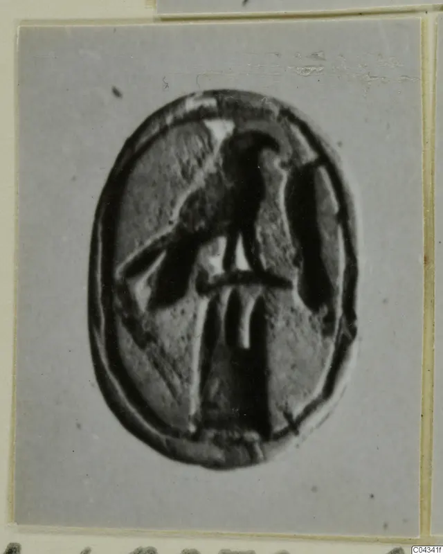 Oval engraved seal or gem from Ayia Irini with a dark incised figure at its centre