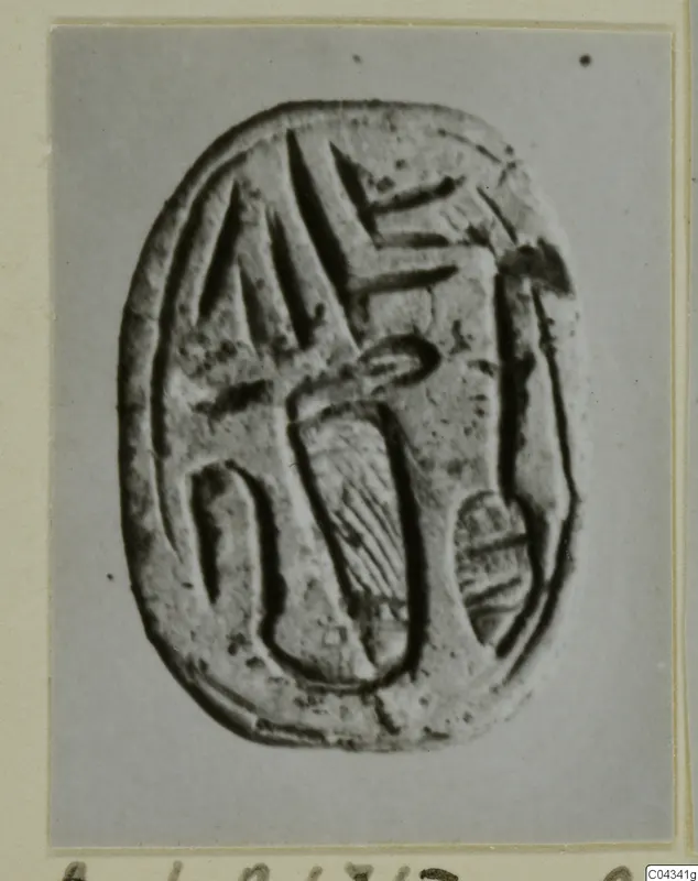 Oval seal with engraved signs on its flat face, photographed from Ayia Irini.