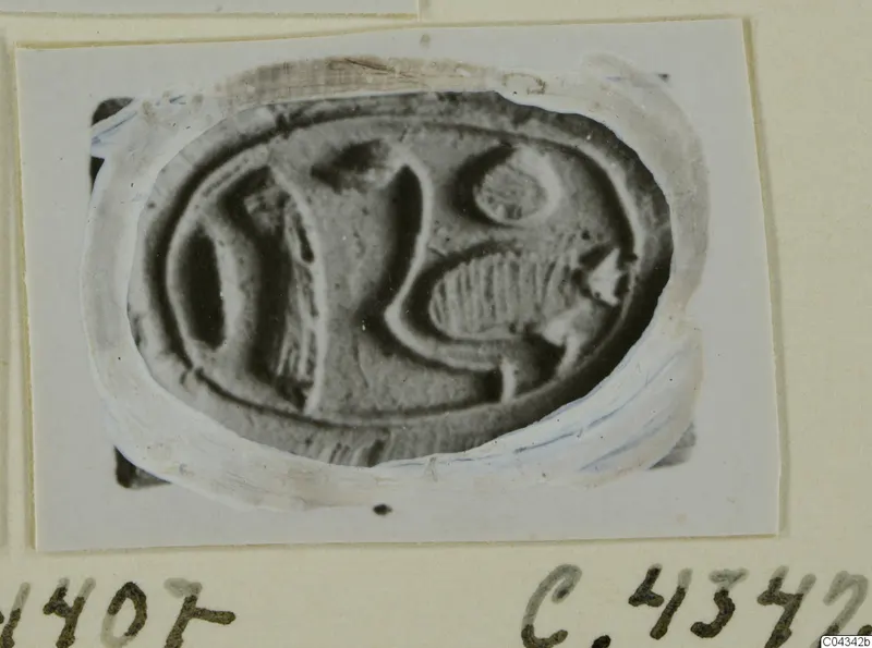 Engraved oval seal or gem from Ayia Irini, photographed close up and mounted on a card