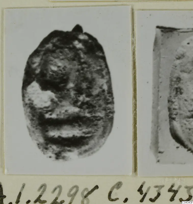 Small oval seal in stone beside a cropped close view of its impression, mounted on a card