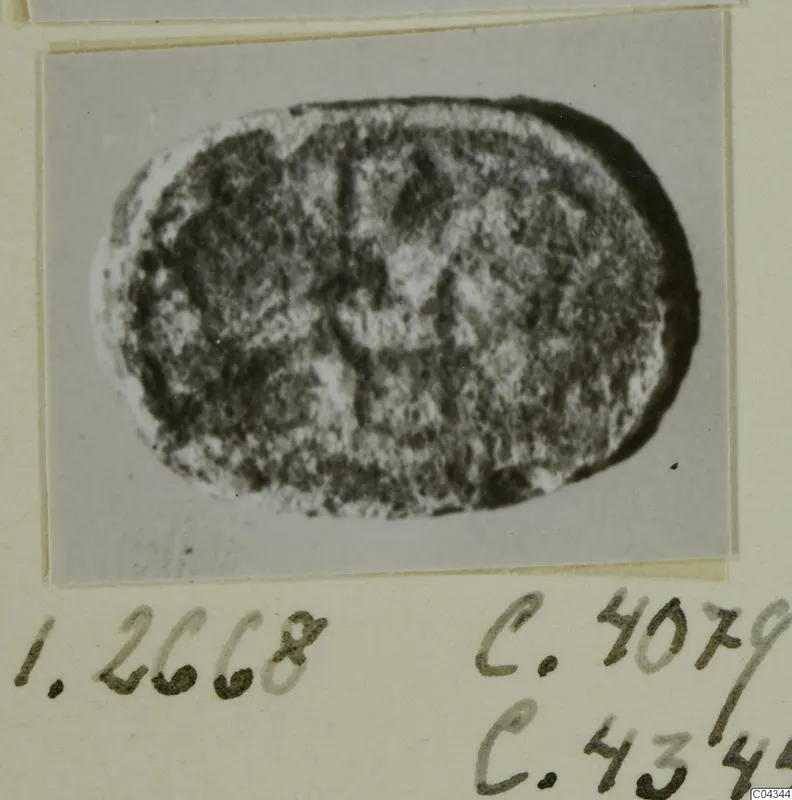 Oval engraved seal or gem, shown as a close photograph mounted on a card.