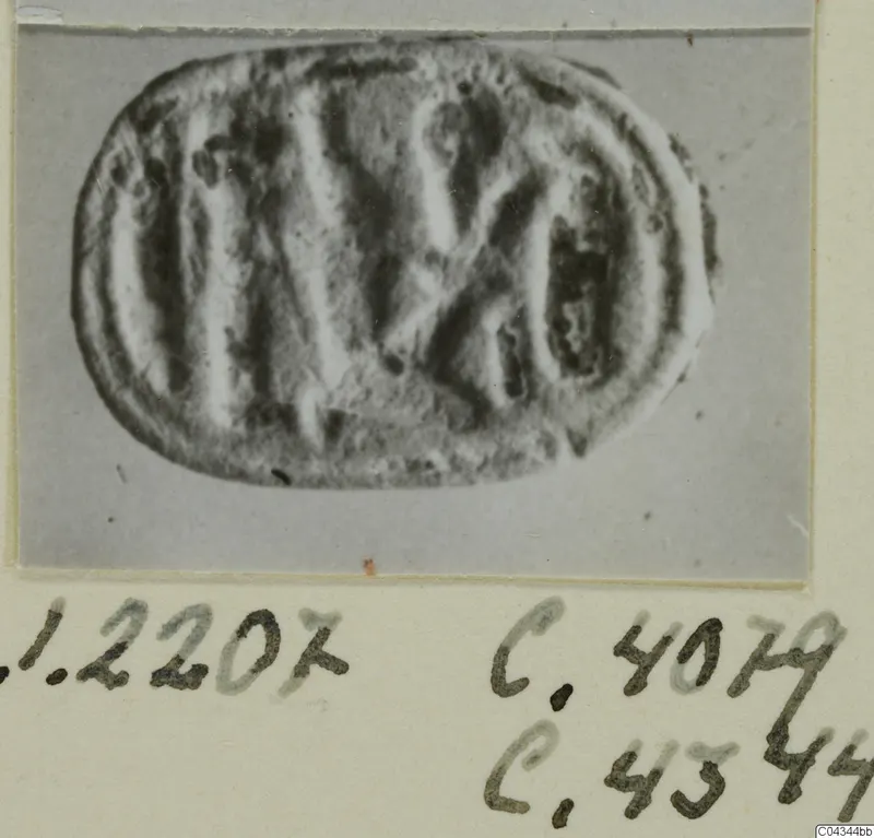 Glyptic object from Ayia Irini: an oval engraved seal or gem, photographed on a card mount
