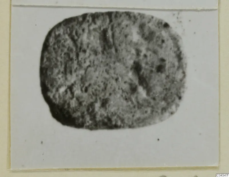 Oval stone glyptic from Ayia Irini, shown in a blurred photograph mounted on a card