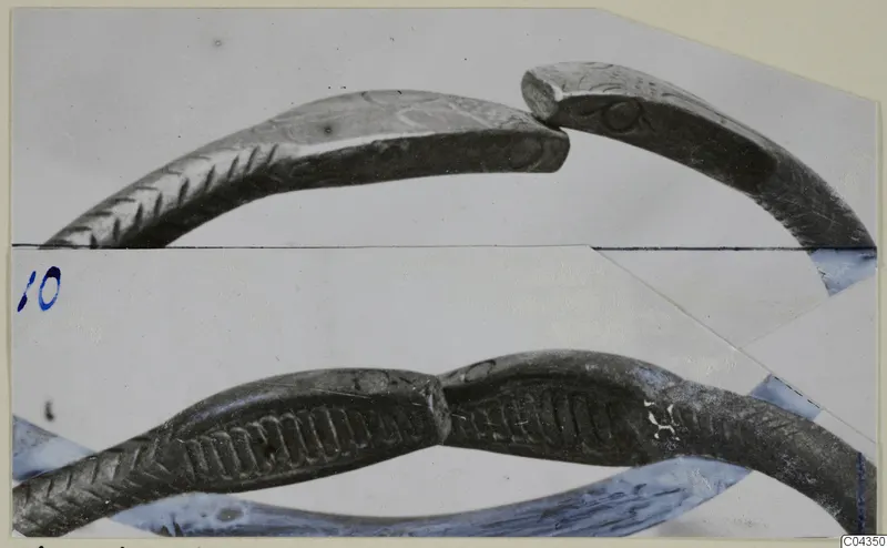 Silver bracelet from Vouni 292, shown in two joined photographs with chevron and ribbed incised decoration