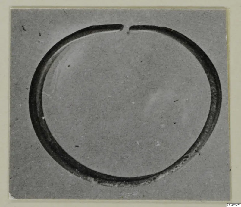 Silver ring with a small gap at the top