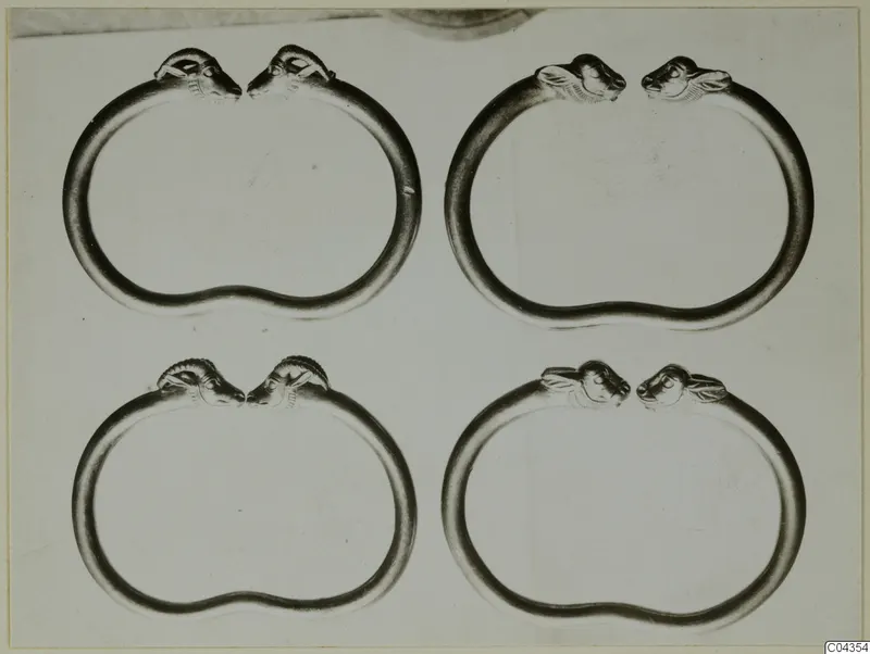 Four gold bracelets with animal-head terminals from Vouni, arranged in two rows of two