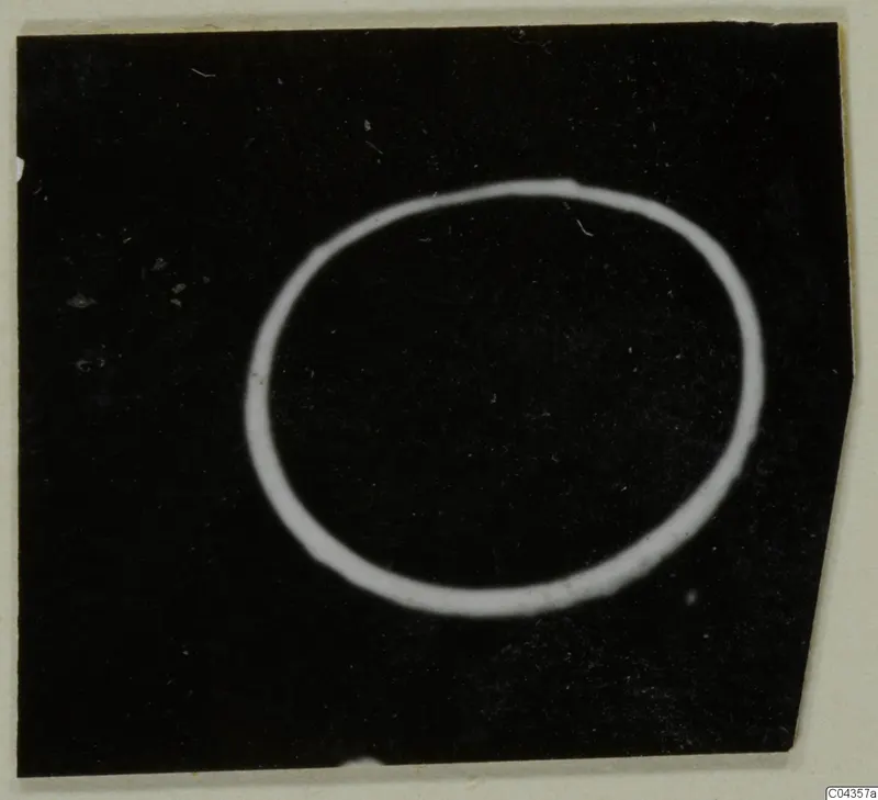 Gold ring from the Kastros tombs at Lapithos, shown against a black background.