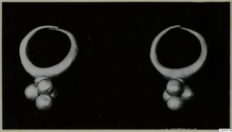 Two gold hoop rings, each with a cluster of small round pendants hanging below, from the Kastros tombs at Lapithos