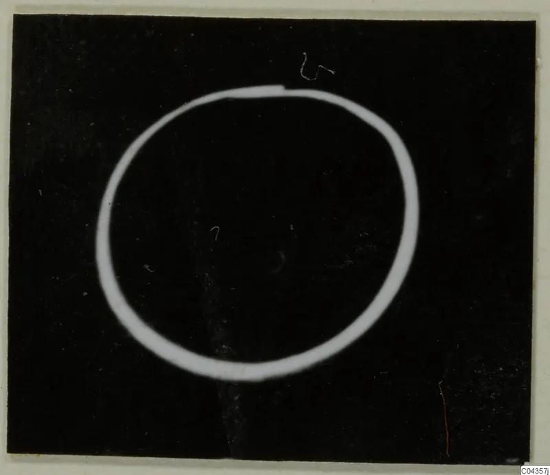 Gold ring shown as a bright oval outline on a black background