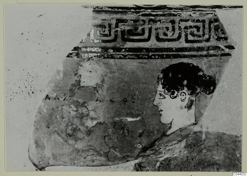 Pottery sherd with a stepped band pattern above and a painted head in profile facing left