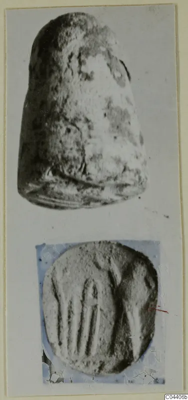 Two photographs of a stone seal: its side view above and its flat engraved face below
