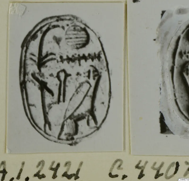 Print of an engraved oval seal with a striped disc and zigzag design, mounted beside a partial impression.