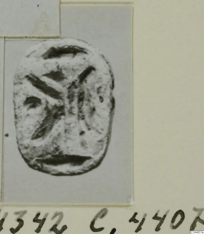 Stone seal or gem from Ayia Irini with an incised design of curved and diagonal strokes