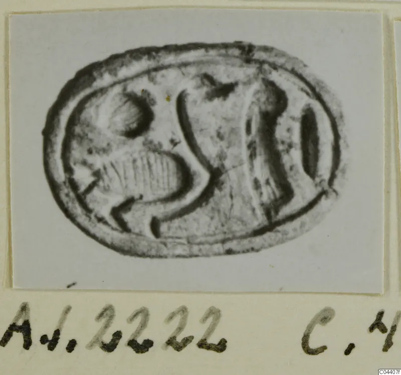 Oval seal-gem with an engraved design, photographed and mounted on a card with a handwritten label, from Ayia Irini