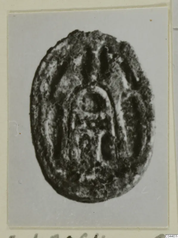 Oval seal or gem with an incised arched design, from Ayia Irini