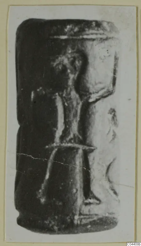 Glyptic: a dark cylinder seal from Ayia Irini, shown in side view on a photo card mount