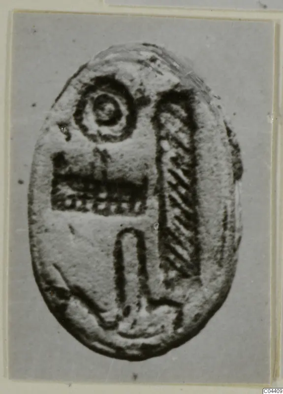 Oval seal or gem from Ayia Irini with an incised design of a ring, hatched panels and an arch motif