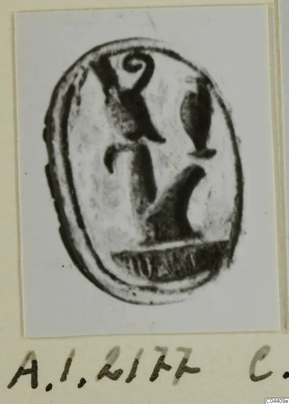 Oval seal or gem with an engraved design, photographed on a pale mount