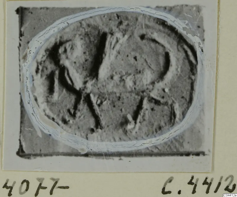 Oval engraved seal or gem from Ayia Irini, shown enlarged on a mounted card