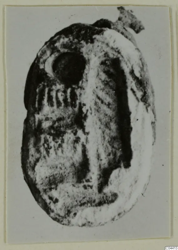 Glyptic (seal or gem) from Ayia Irini, an oval engraved object photographed on a card mount