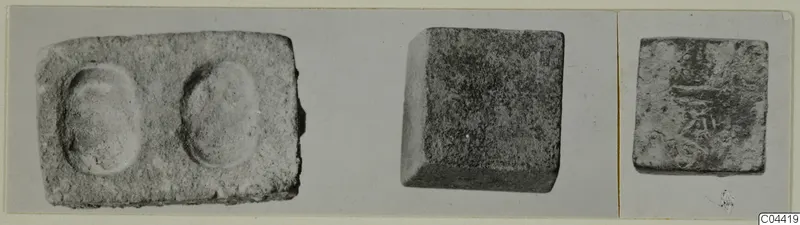 Three block-shaped objects in separate views; the left one has two oval hollows in its top face.