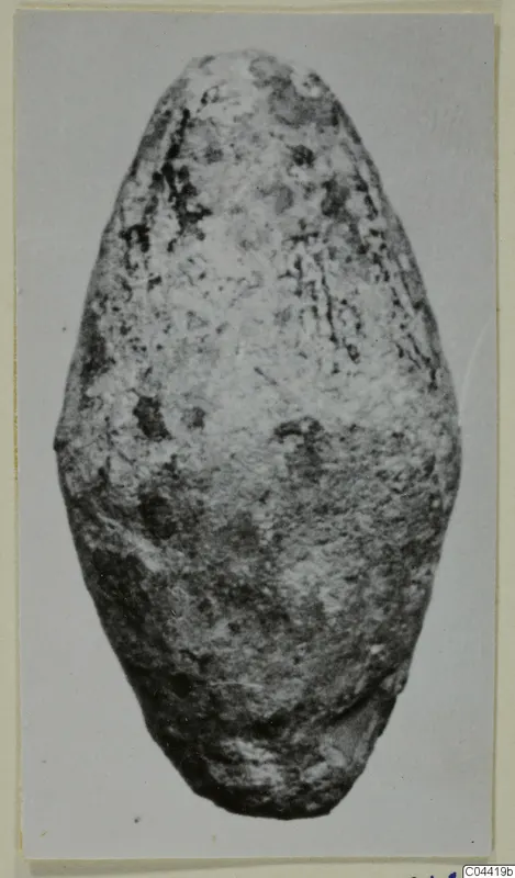 Ovoid lead object from Idalion, corroded and pitted, narrower at the top