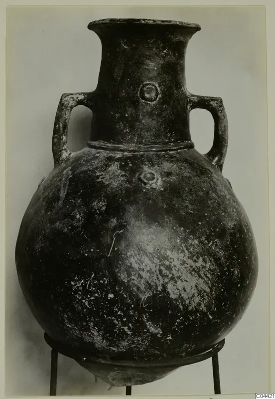 Pottery Red Polished II amphora with two handles and a rounded body, shown on a metal stand.