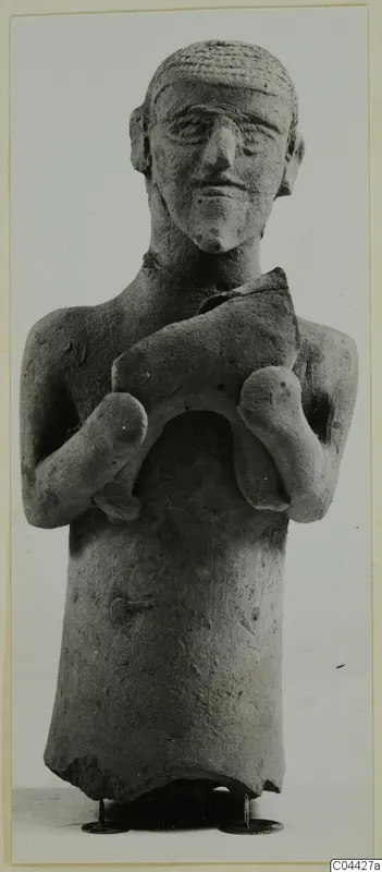 Terracotta figurine of a standing human figure holding a curved object across its chest