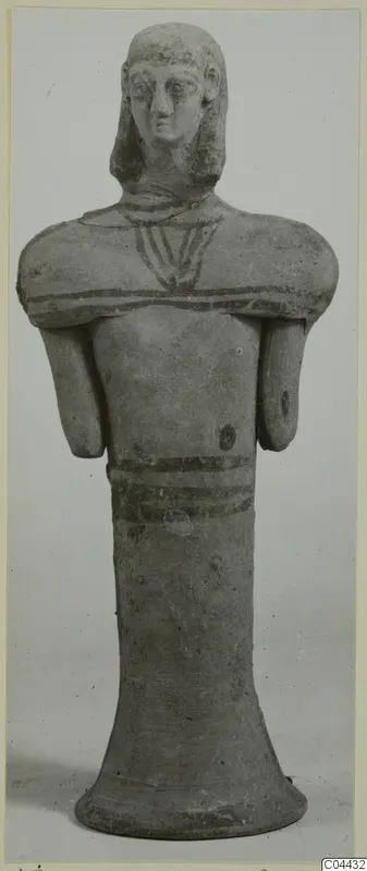 Terracotta figurine of a standing figure with painted bands, from Ayia Irini