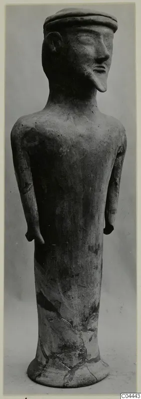 Terracotta standing human figure with a flat cap, long neck and arms at its sides, Terracotta Minor Plastic 3