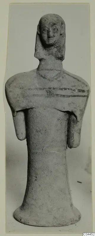 Terracotta figurine of a standing figure with painted bands at the neck and shoulders