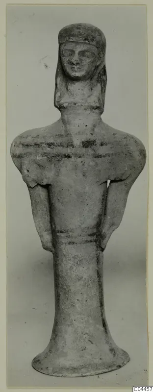 Terracotta figurine of a standing figure from Ayia Irini, front view against a plain background
